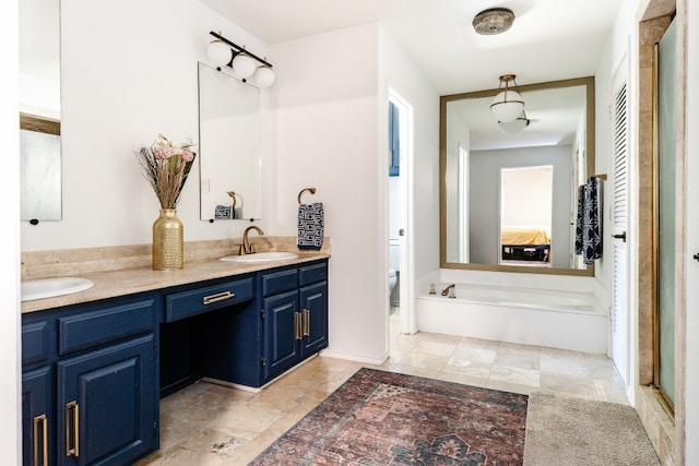 2304 Wakeforest Ct, Arlington, TX 76012 - full bathroom with double vanity, ensuite bathroom, an enclosed shower, and a garden tub