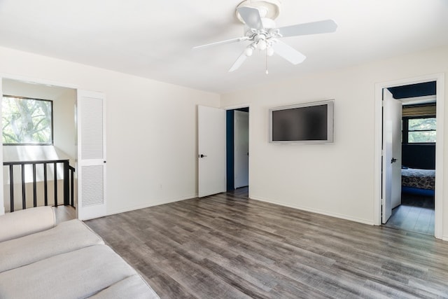 2304 Wakeforest Ct, Arlington, TX 76012 - unfurnished living room with wood finished floors and a ceiling fan