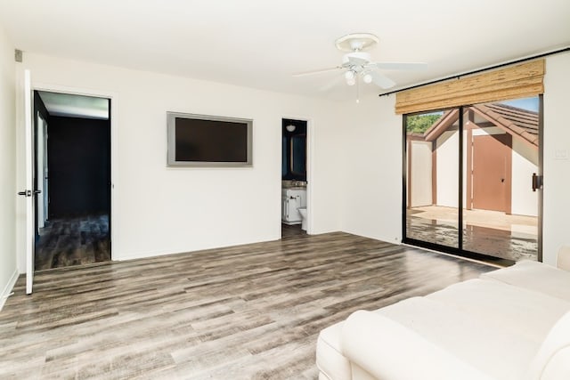 2304 Wakeforest Ct, Arlington, TX 76012 - bedroom featuring wood finished floors, ensuite bath, and a ceiling fan