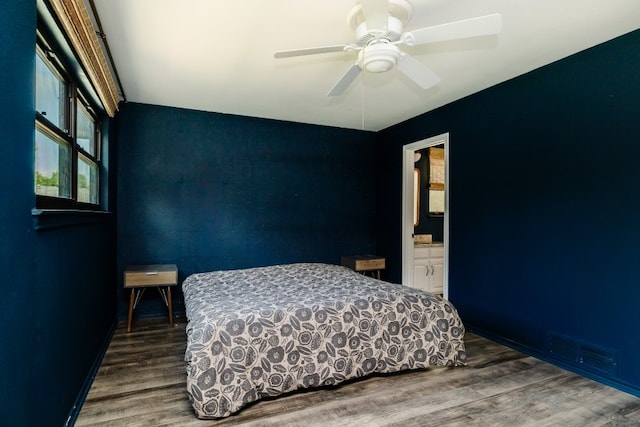 2304 Wakeforest Ct, Arlington, TX 76012 - bedroom featuring wood finished floors, ceiling fan, and connected bathroom