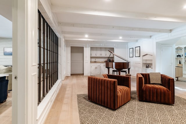 2304 Wakeforest Ct, Arlington, TX 76012 - living area with light wood-style flooring and beam ceiling
