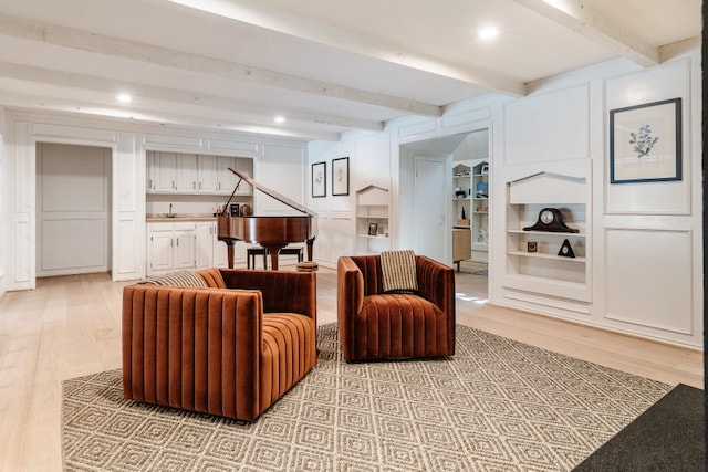 2304 Wakeforest Ct, Arlington, TX 76012 - living area featuring light wood-style flooring, beamed ceiling, built in features, and recessed lighting