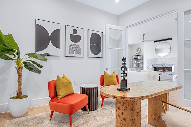 350 O Connor Ridge Blvd Unit 13, Irving, TX 75038 - living area with wood finished floors, ceiling fan, a high end fireplace, and recessed lighting
