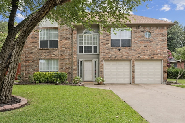 113 Windmill Ridge Dr, Rockwall, TX 75032 - view of front of house featuring concrete driveway, a front yard, a garage, and brick siding