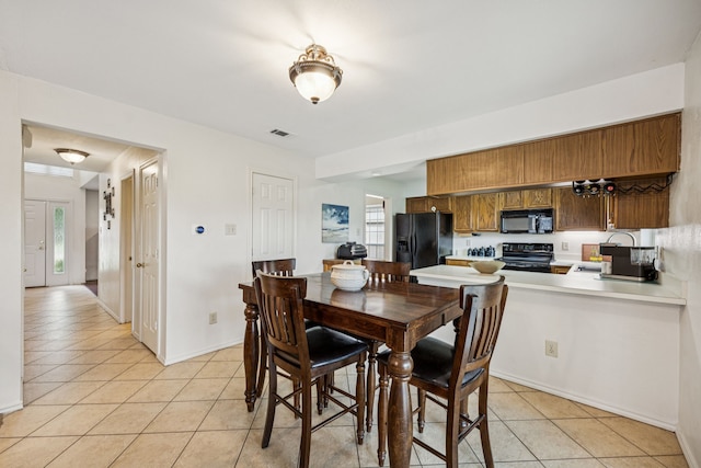113 Windmill Ridge Dr, Rockwall, TX 75032 - dining space featuring light tile patterned floors