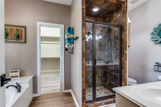 412 Paradise Canyon Cir, Paradise, TX 76073 - full bath with a shower stall, a garden tub, wood finished floors, and a walk in closet