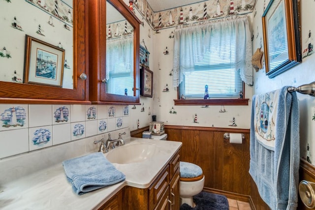 12869 Fm 1385, Pilot Point, TX 76258 - bathroom featuring vanity, a wainscoted wall, and tasteful backsplash