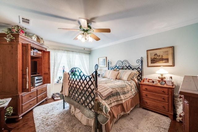 12869 Fm 1385, Pilot Point, TX 76258 - bedroom with ornamental molding, wood finished floors, and a ceiling fan