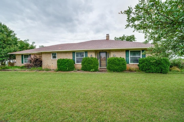 12869 Fm 1385, Pilot Point, TX 76258 - single story home with brick siding and a front lawn