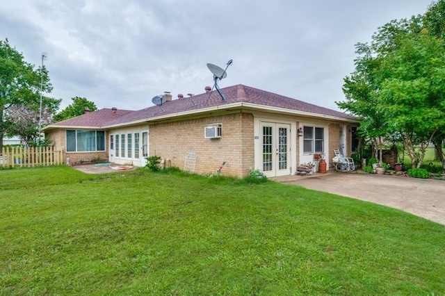 12869 Fm 1385, Pilot Point, TX 76258 - back of house with french doors, brick siding, a patio area, and a wall mounted air conditioner
