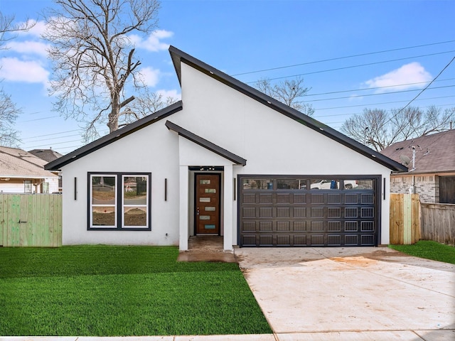 2610 S Ewing Ave, Dallas, TX 75216 - view of front of property with stucco siding, concrete driveway, and a garage