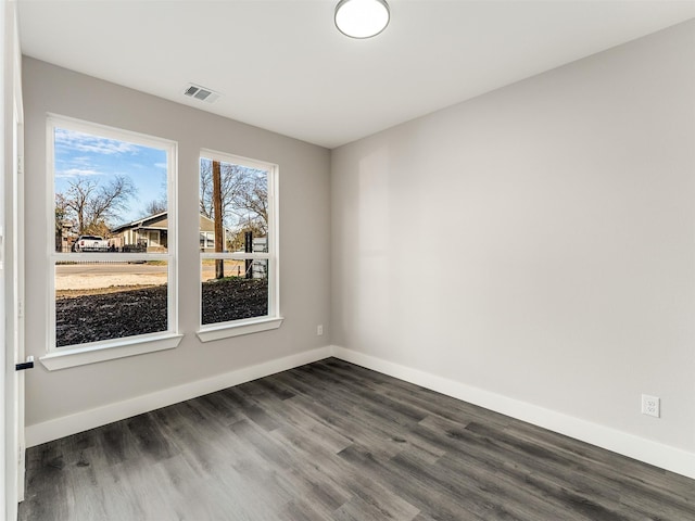 2610 S Ewing Ave, Dallas, TX 75216 - empty room featuring dark wood-style floors and baseboards