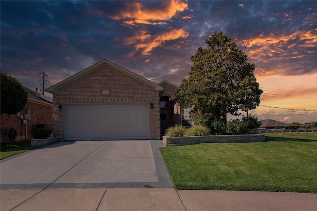 12953 Hurricane Ln, Fort Worth, TX 76244 - view of front of property featuring brick siding, a yard, driveway, and a garage