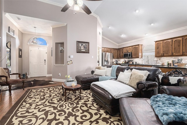 12953 Hurricane Ln, Fort Worth, TX 76244 - living area with dark wood-style floors, ornamental molding, a ceiling fan, and high vaulted ceiling
