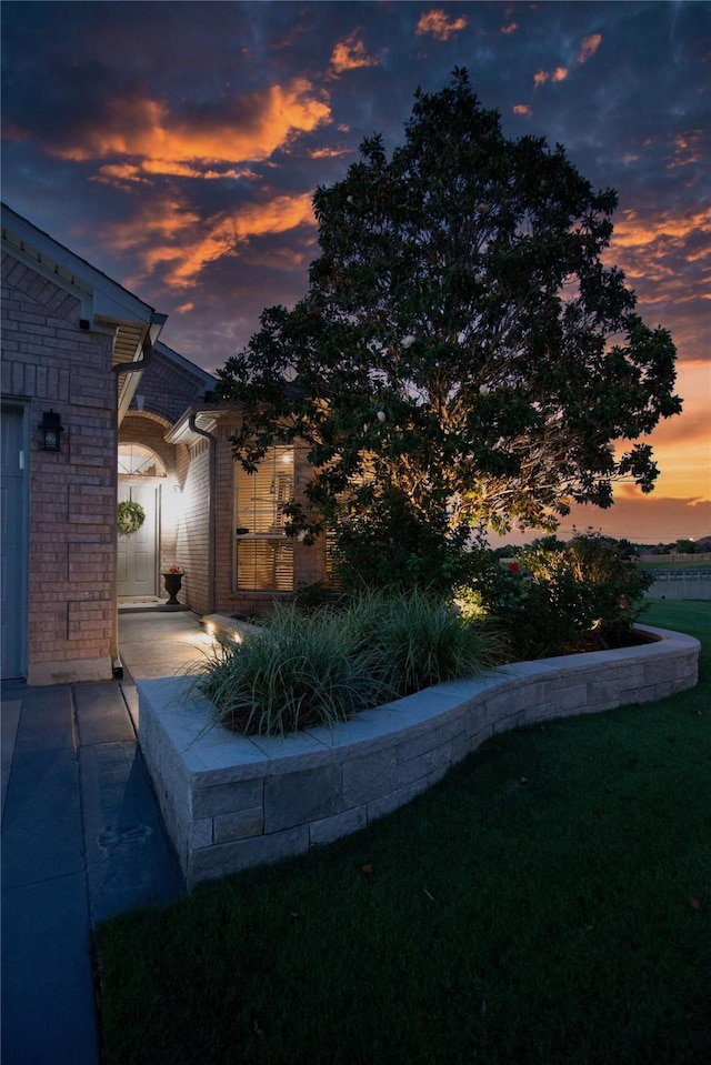12953 Hurricane Ln, Fort Worth, TX 76244 - view of property exterior with brick siding and a lawn