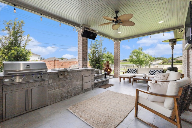 12953 Hurricane Ln, Fort Worth, TX 76244 - view of patio / terrace featuring exterior kitchen, an outdoor hangout area, and a ceiling fan