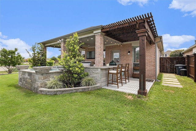12953 Hurricane Ln, Fort Worth, TX 76244 - rear view of property with a fenced backyard, brick siding, a pergola, and a patio area