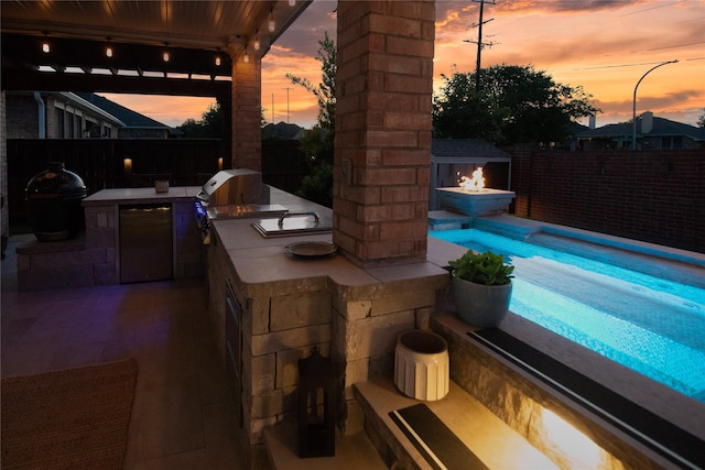 12953 Hurricane Ln, Fort Worth, TX 76244 - fenced backyard with exterior kitchen and a patio area
