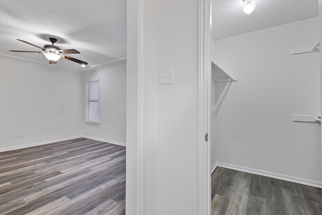 2206 Spring Leaf Dr, Carrollton, TX 75006 - spacious closet featuring ceiling fan and wood finished floors