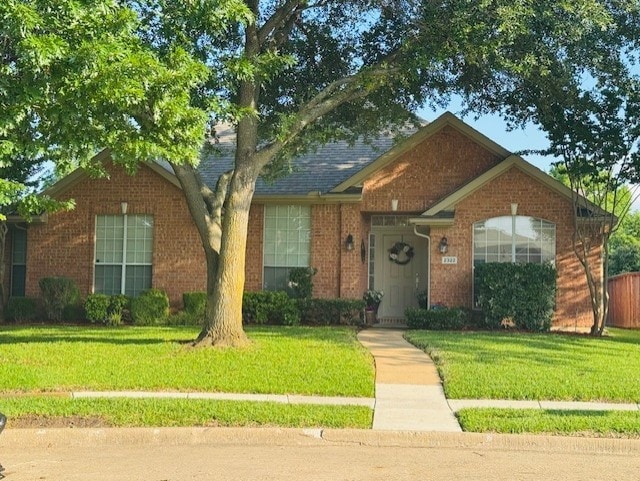 2322 Greenfield Cir, Garland, TX 75040 - single story home with a front lawn and brick siding