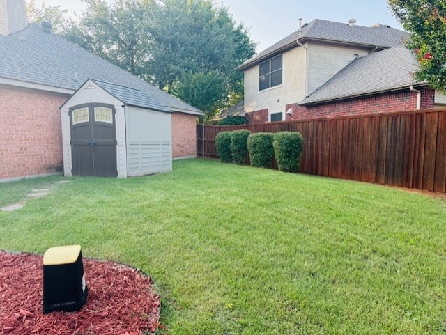 2322 Greenfield Cir, Garland, TX 75040 - fenced backyard with a storage unit