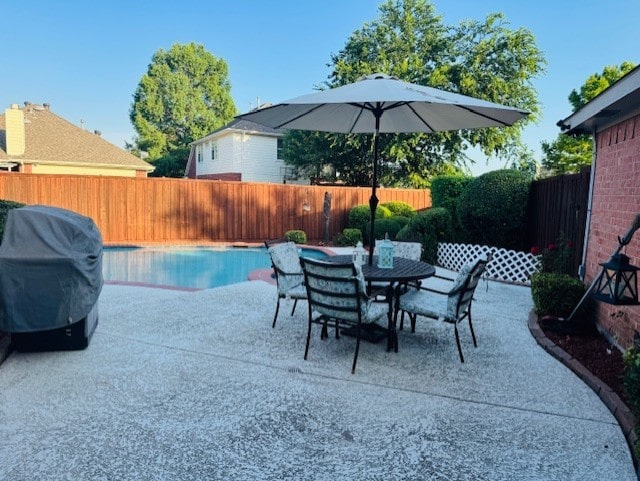 2322 Greenfield Cir, Garland, TX 75040 - view of swimming pool featuring a fenced backyard, a patio area, and outdoor dining area