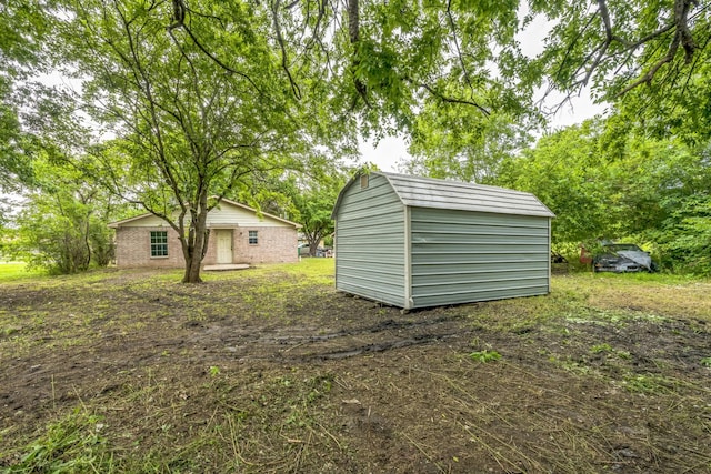 207 N 1st St, Crandall, TX 75114 - view of yard featuring a storage shed