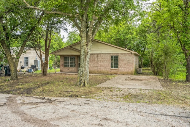 207 N 1st St, Crandall, TX 75114 - view of front of property with brick siding