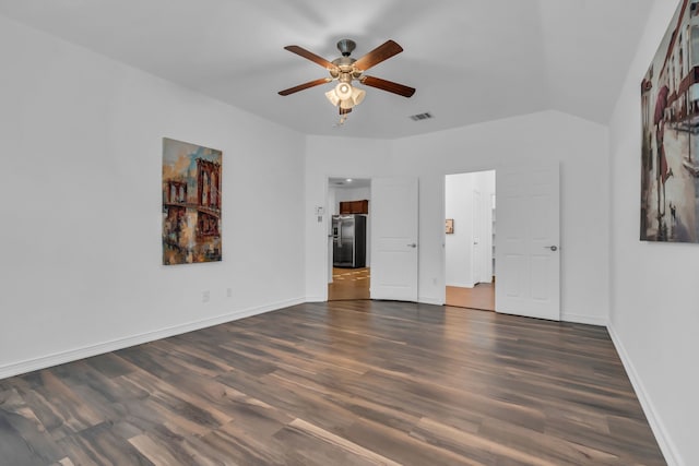 9700 Mulligan Dr, Mckinney, TX 75072 - unfurnished bedroom with stainless steel fridge, dark wood finished floors, and ceiling fan