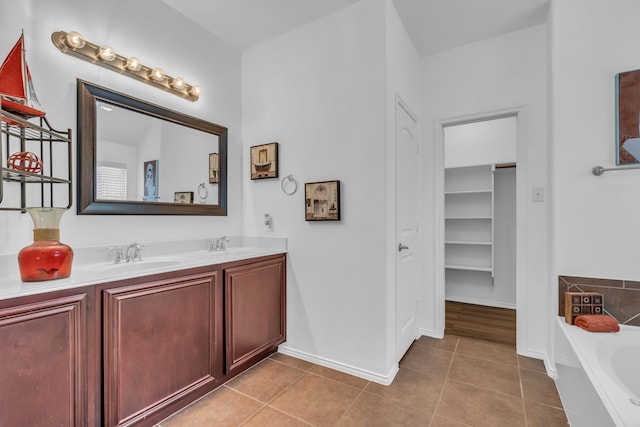 9700 Mulligan Dr, Mckinney, TX 75072 - full bath featuring double vanity, a garden tub, and tile patterned flooring