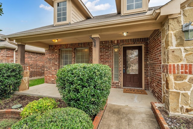 9700 Mulligan Dr, Mckinney, TX 75072 - property entrance with a porch and brick siding