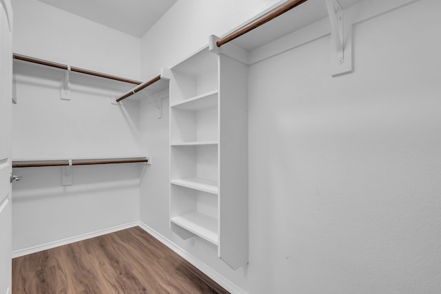9700 Mulligan Dr, Mckinney, TX 75072 - walk in closet with wood finished floors