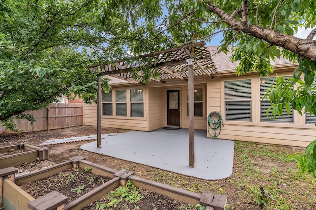 9700 Mulligan Dr, Mckinney, TX 75072 - rear view of house featuring a patio area and a vegetable garden