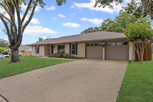 6767 Winifred Dr, Fort Worth, TX 76133 - ranch-style home with brick siding, an attached garage, concrete driveway, and a front yard