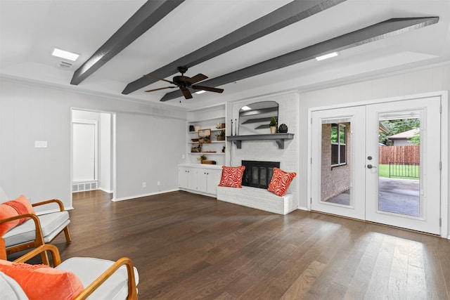6767 Winifred Dr, Fort Worth, TX 76133 - living room featuring dark wood-type flooring, beam ceiling, french doors, a ceiling fan, and a fireplace