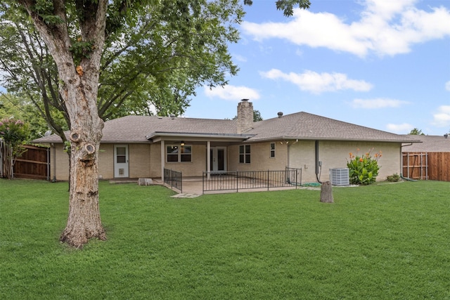 6767 Winifred Dr, Fort Worth, TX 76133 - rear view of house with a fenced backyard, a chimney, a patio area, roof with shingles, and brick siding