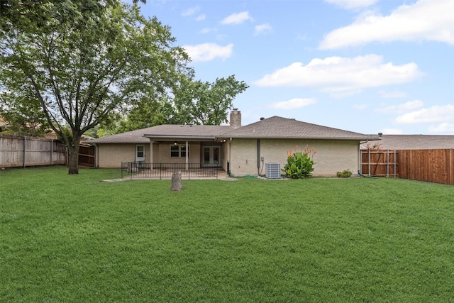 6767 Winifred Dr, Fort Worth, TX 76133 - back of property with a fenced backyard, a patio, a chimney, and brick siding