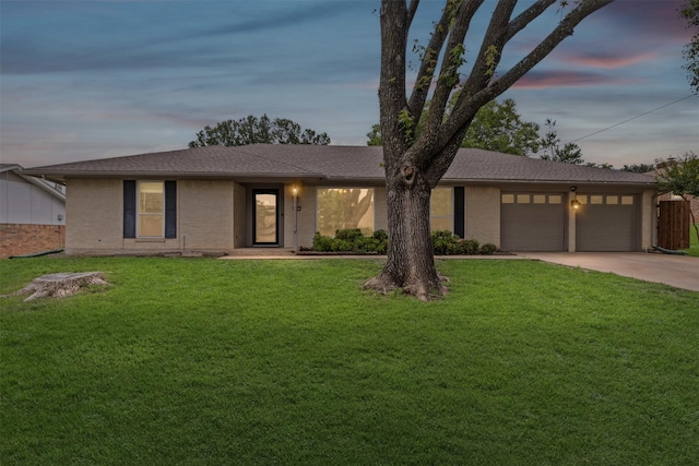 6767 Winifred Dr, Fort Worth, TX 76133 - view of front facade featuring an attached garage, concrete driveway, and brick siding