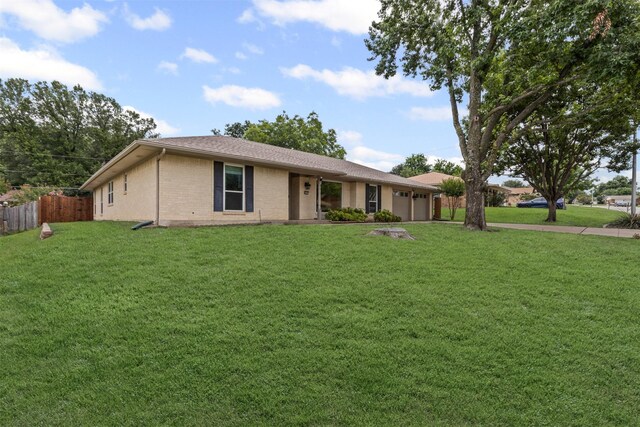 6767 Winifred Dr, Fort Worth, TX 76133 - ranch-style home featuring a garage, brick siding, and driveway