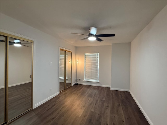 2761 Stonecreek Dr, Carrollton, TX 75006 - unfurnished bedroom with dark wood-style flooring and a ceiling fan