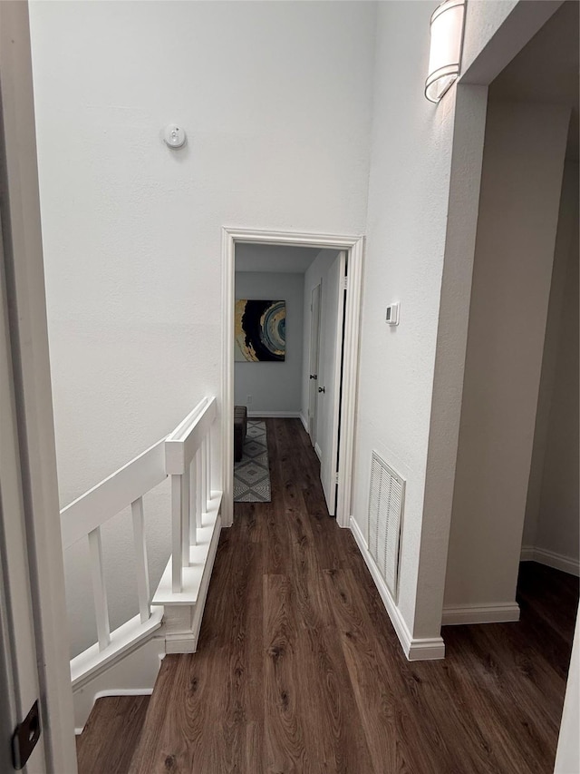 2761 Stonecreek Dr, Carrollton, TX 75006 - hall with dark wood-type flooring and baseboards