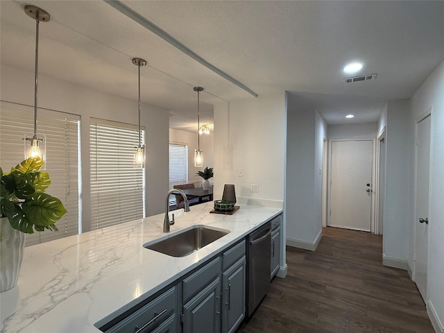 2761 Stonecreek Dr, Carrollton, TX 75006 - kitchen with stainless steel dishwasher, dark wood-style flooring, hanging light fixtures, light stone counters, and recessed lighting