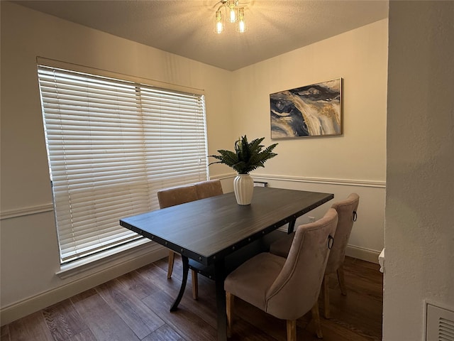 2761 Stonecreek Dr, Carrollton, TX 75006 - dining space with wood finished floors and a textured ceiling