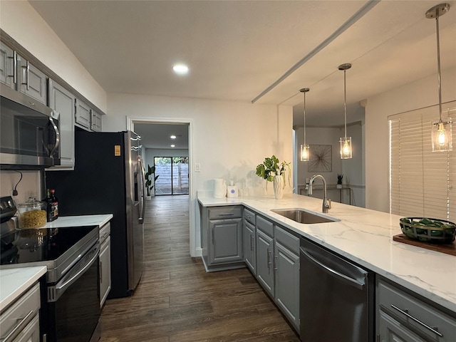 2761 Stonecreek Dr, Carrollton, TX 75006 - kitchen featuring stainless steel appliances, gray cabinets, dark wood-style flooring, recessed lighting, and pendant lighting
