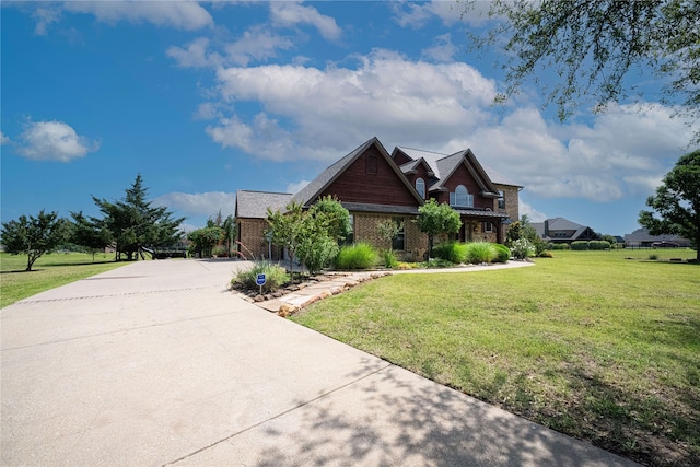 105 Lavender Pl, Mclendon Chisholm, TX 75032 - view of front facade with concrete driveway, a front yard, and brick siding