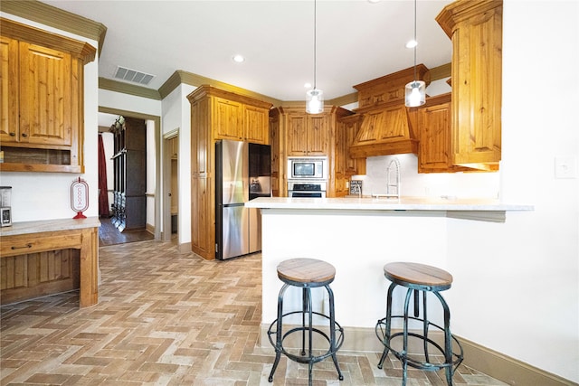 105 Lavender Pl, Mclendon Chisholm, TX 75032 - kitchen featuring stainless steel appliances, a peninsula, light countertops, a breakfast bar area, and recessed lighting