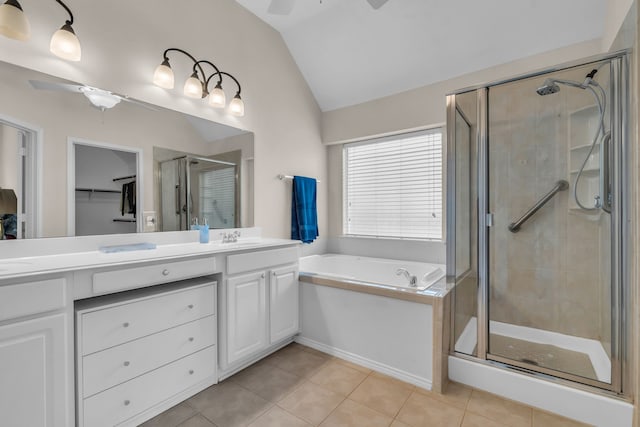 1651 Meadows Ave, Lantana, TX 76226 - full bath with a ceiling fan, lofted ceiling, double vanity, a shower stall, and a garden tub
