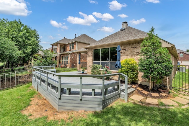 1651 Meadows Ave, Lantana, TX 76226 - back of property featuring brick siding, a chimney, a wooden deck, and a shingled roof