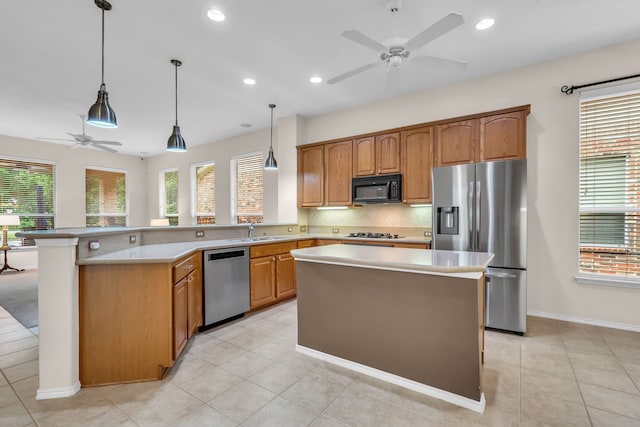 1651 Meadows Ave, Lantana, TX 76226 - kitchen featuring appliances with stainless steel finishes, ceiling fan, backsplash, light countertops, and recessed lighting