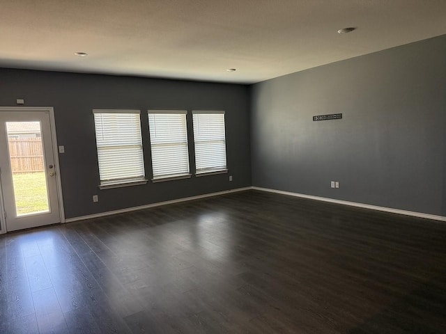 312 Wagon Wheel Dr, Josephine, TX 75189 - spare room featuring dark wood finished floors, plenty of natural light, and recessed lighting